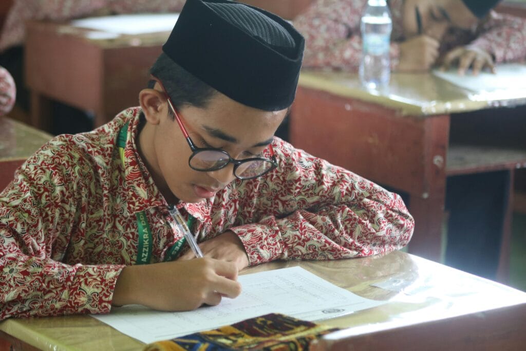 A Boy Taking a Test at School